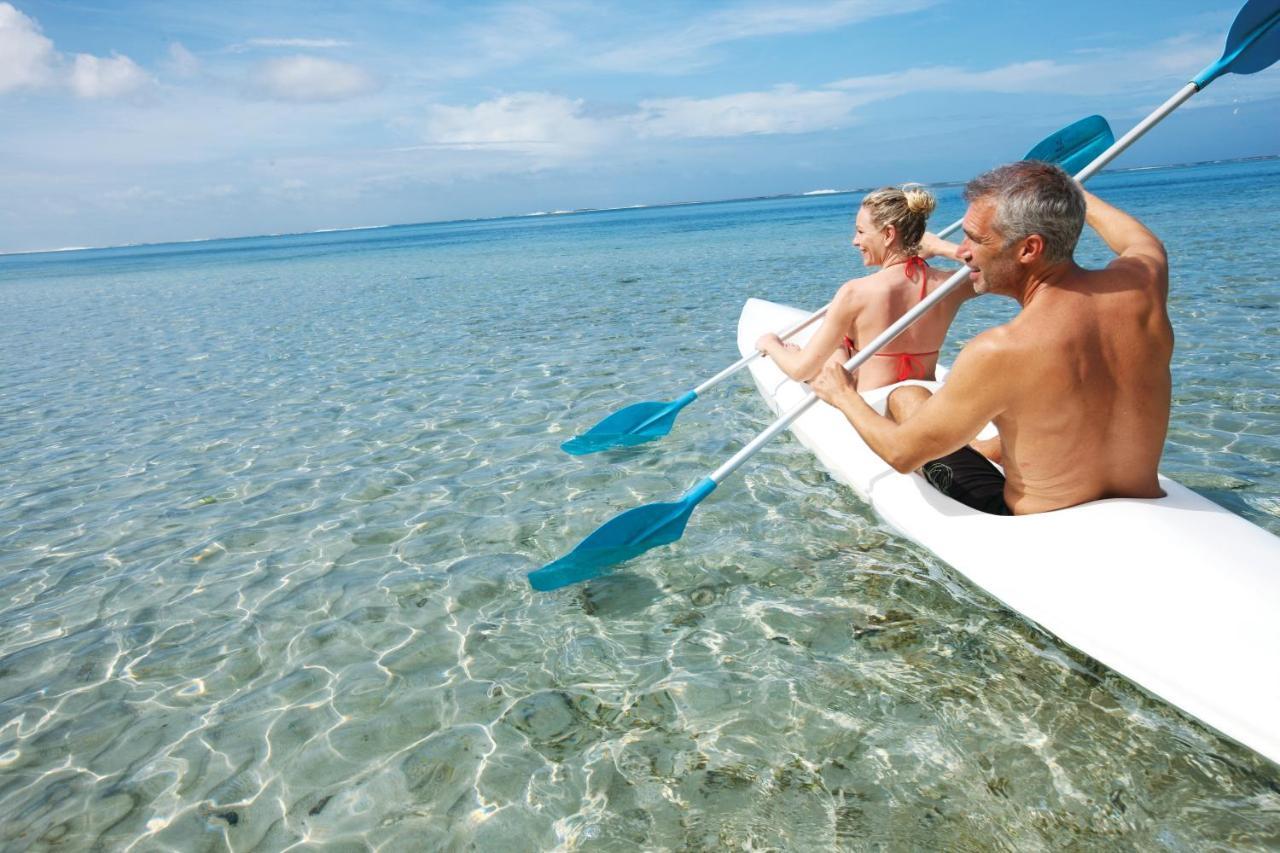 Heritage Le Telfair Golf&Wellness Resort Bel Ombre Exterior foto Kayaking in the Maldives