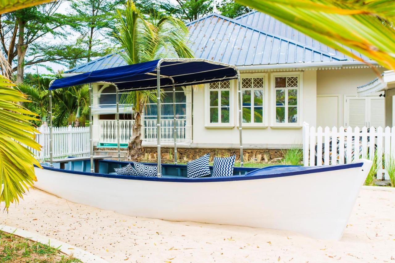 Heritage Le Telfair Golf&Wellness Resort Bel Ombre Exterior foto The boat house at the beach