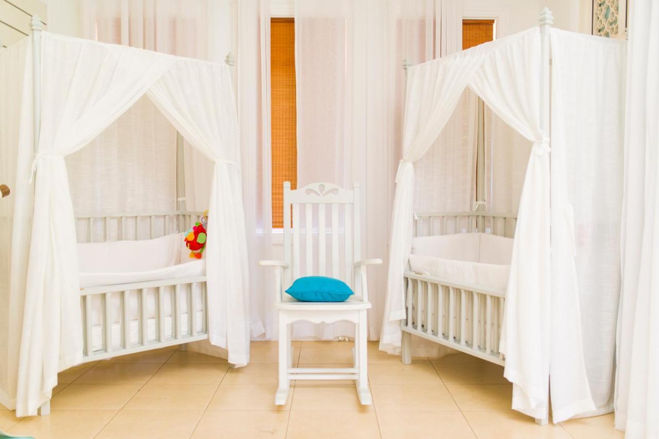 Heritage Le Telfair Golf&Wellness Resort Bel Ombre Exterior foto Two cots with mosquito nets