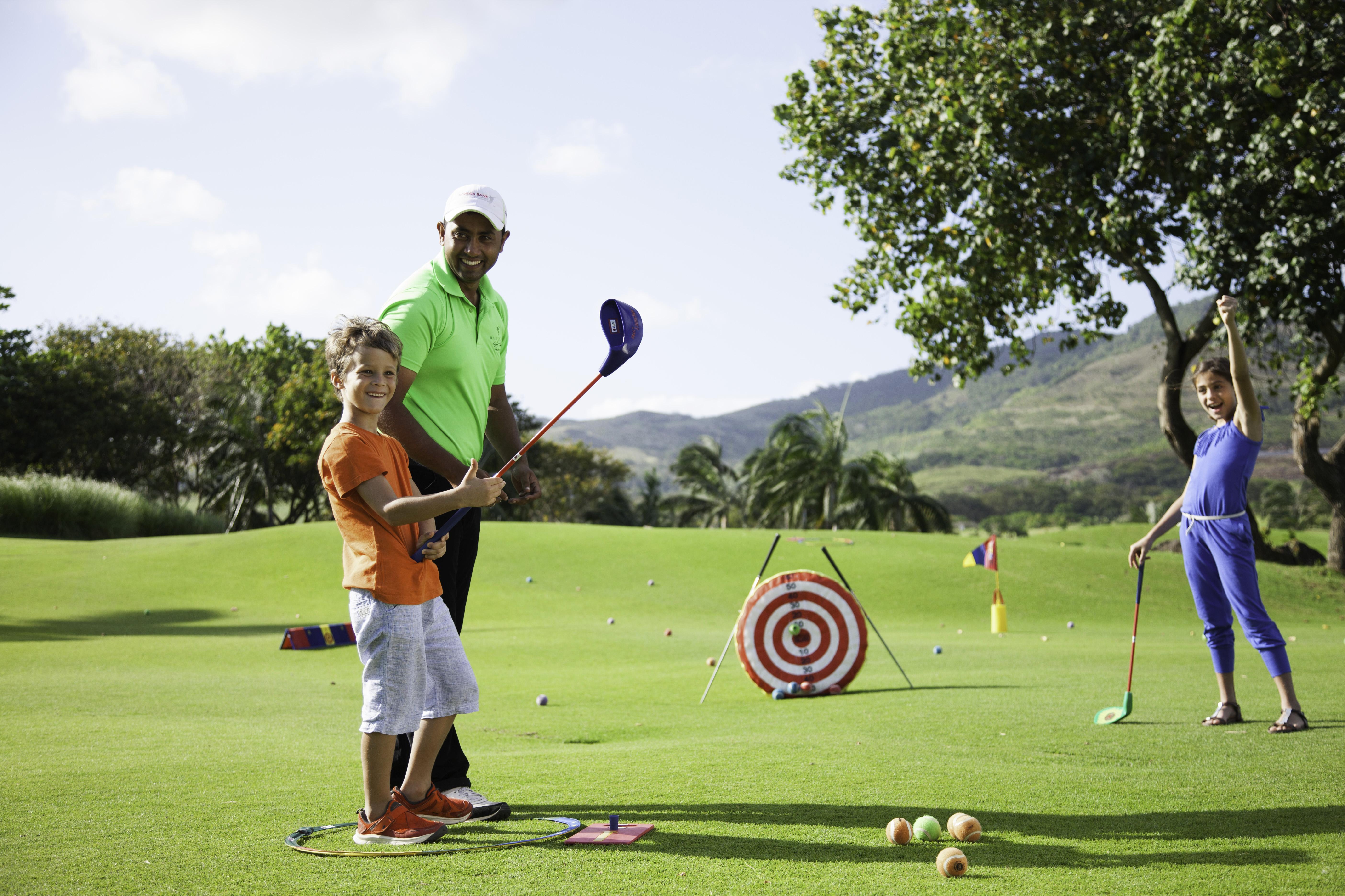 Heritage Le Telfair Golf&Wellness Resort Bel Ombre Exterior foto Tiger Woods with his children